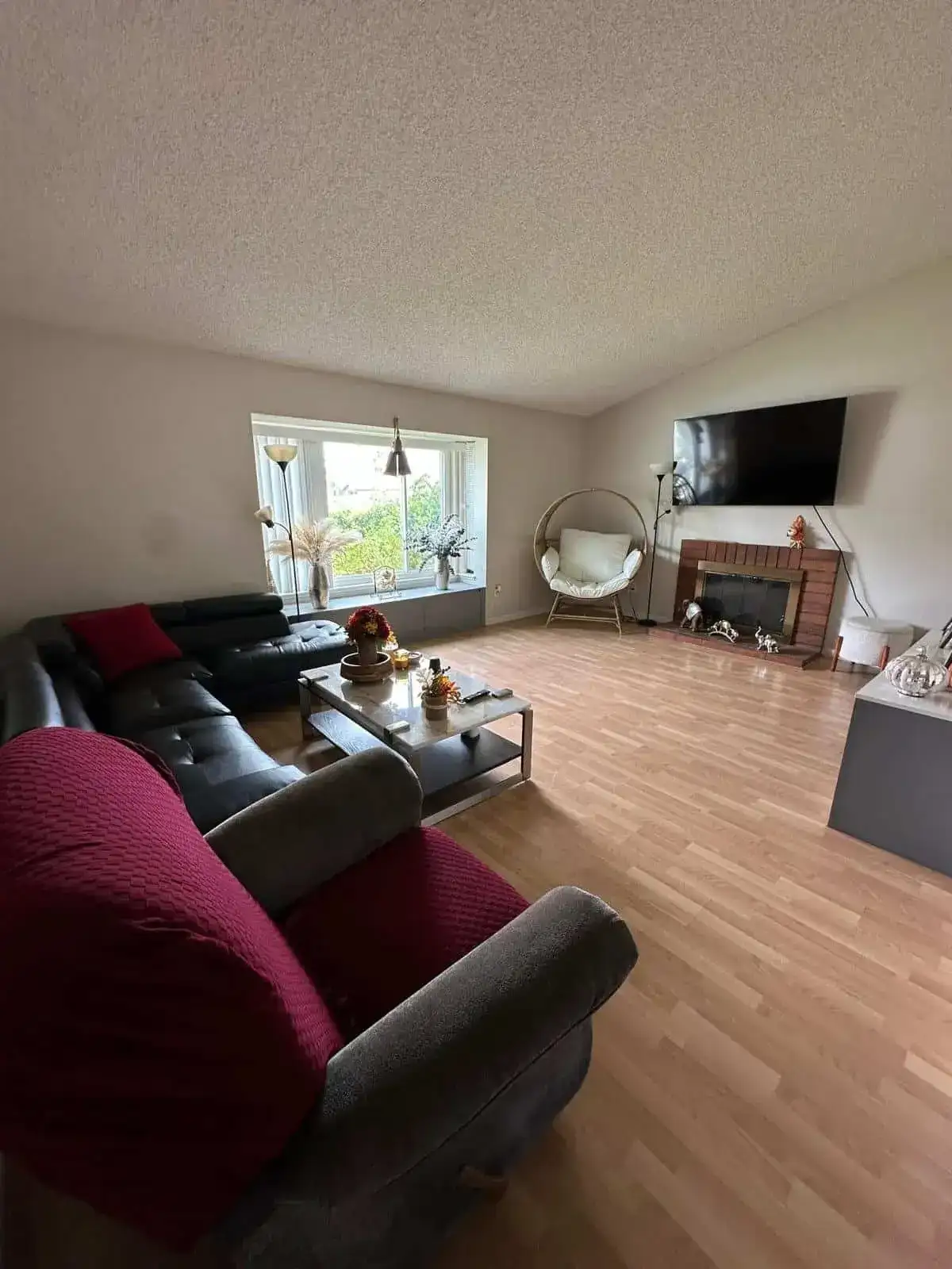 The same living room after a Lumiora cleaning visit, tidy and styled