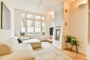 Bright, tidy living room representative of Lumiora's recurring house cleaning service (stock photo)