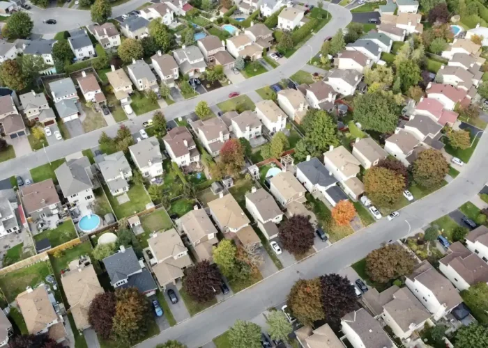 Aerial view of a suburban neighborhood, representative of Lake Elsinore-style hillside communities (stock photo, not an actual Lumiora job site)